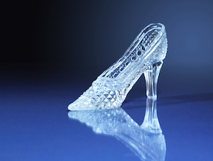 Nice glass slipper on dark blue background with free space for text